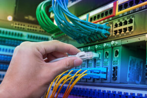 plugging network cables into a high end switch.